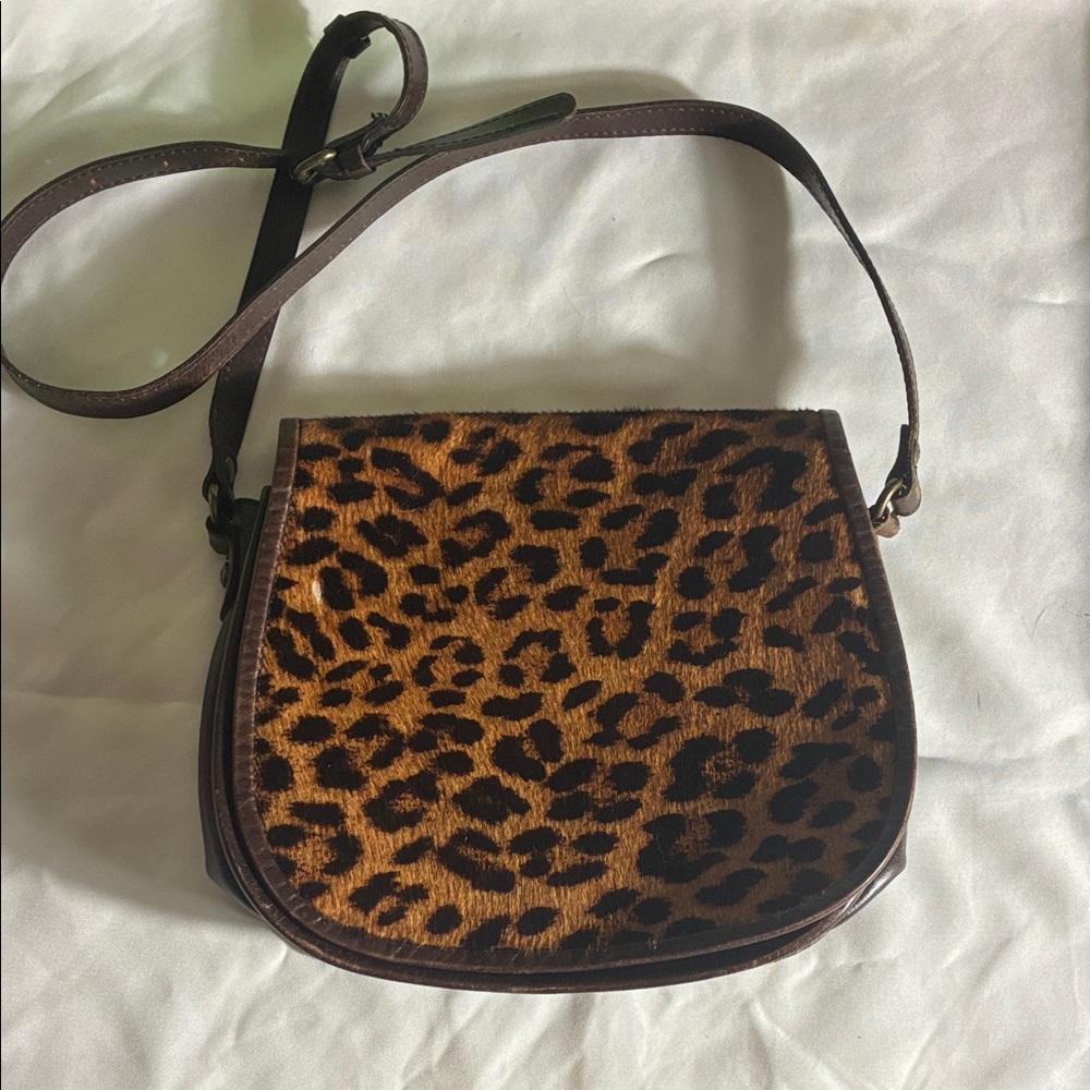 Patricia Nash brown leather shoulder bag. Leopard print front with suede lining